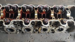 cylinder head rebuild. lapping valves and vacuum testing heads 3