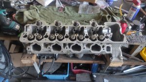 cylinder head rebuild. lapping valves and vacuum testing heads 5